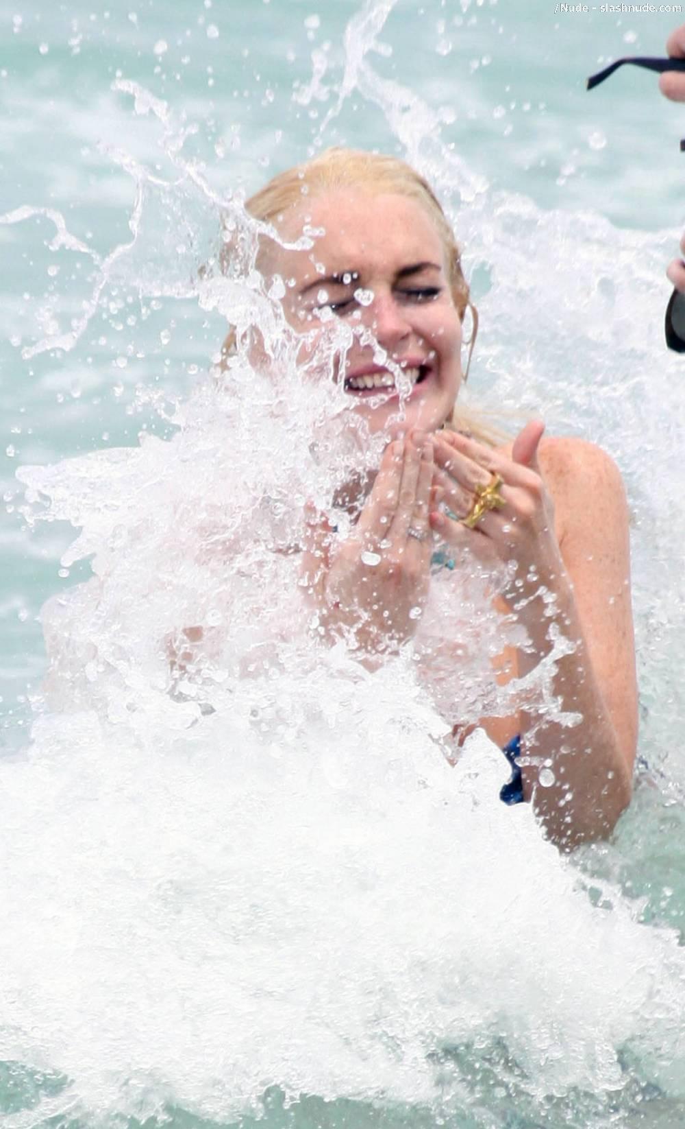 Lindsay Lohan Breasts Slip Of Her Bikini In Miami 8