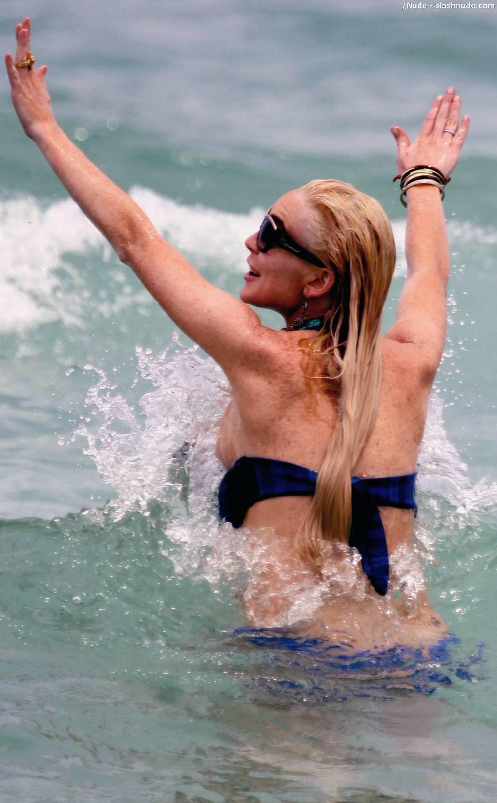 Lindsay Lohan Breasts Slip Of Her Bikini In Miami 9