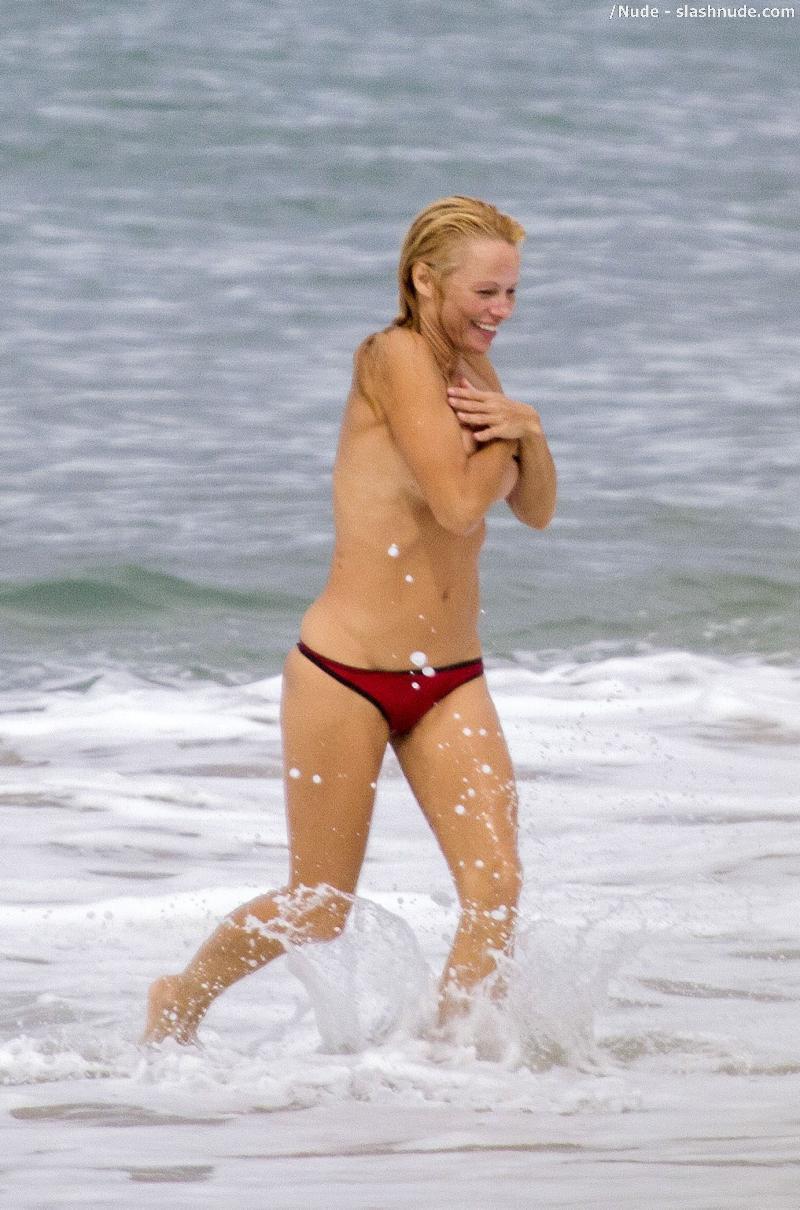 Pamela Anderson Topless Run At French Beach 10
