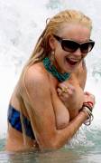 lindsay lohan breasts slip of her bikini in miami 3767 6