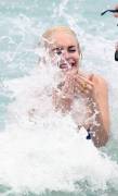 lindsay lohan breasts slip of her bikini in miami 3767 8