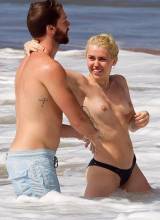 miley cyrus bares topless breasts with boyfriend at beach 3085 1