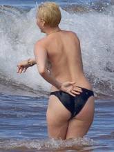 miley cyrus bares topless breasts with boyfriend at beach 3085 5
