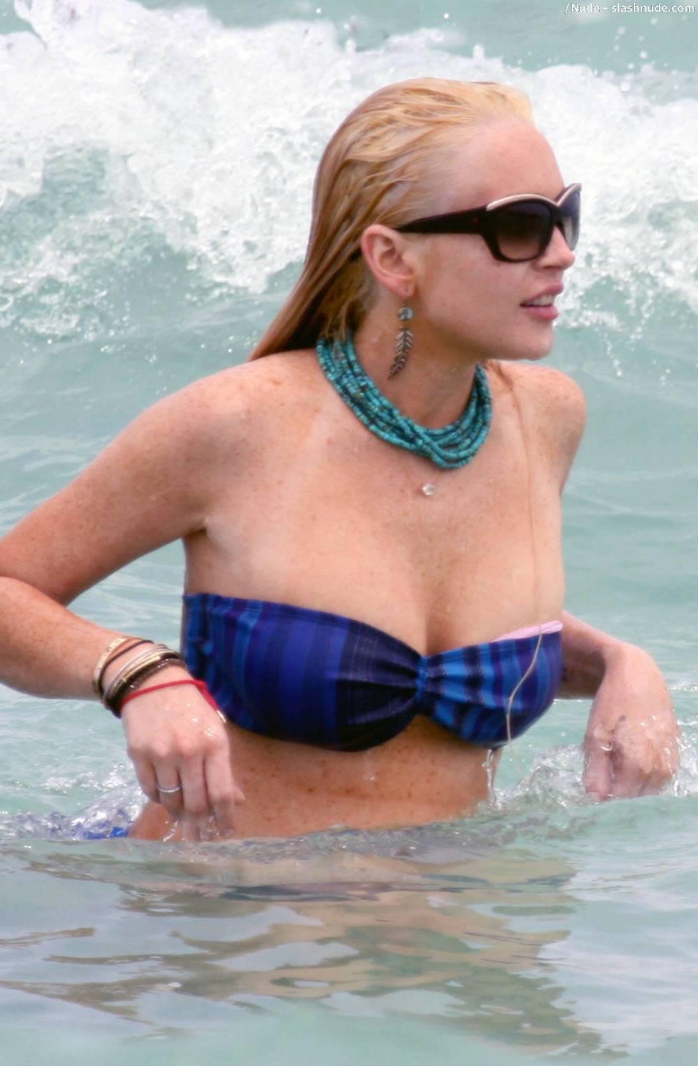 Lindsay Lohan Breasts Slip Of Her Bikini In Miami 4